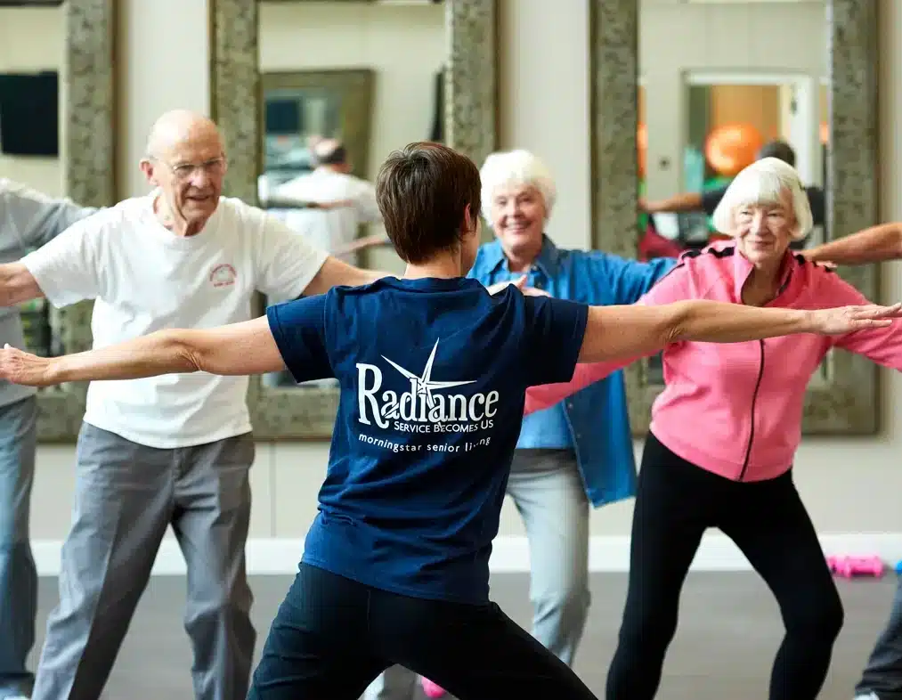 Resident laughing with a caregiver